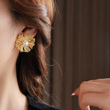 These earrings perfectly blend delicate flowers with lustrous pearls, exuding timeless romance and adding an elegant touch to any outfit.
