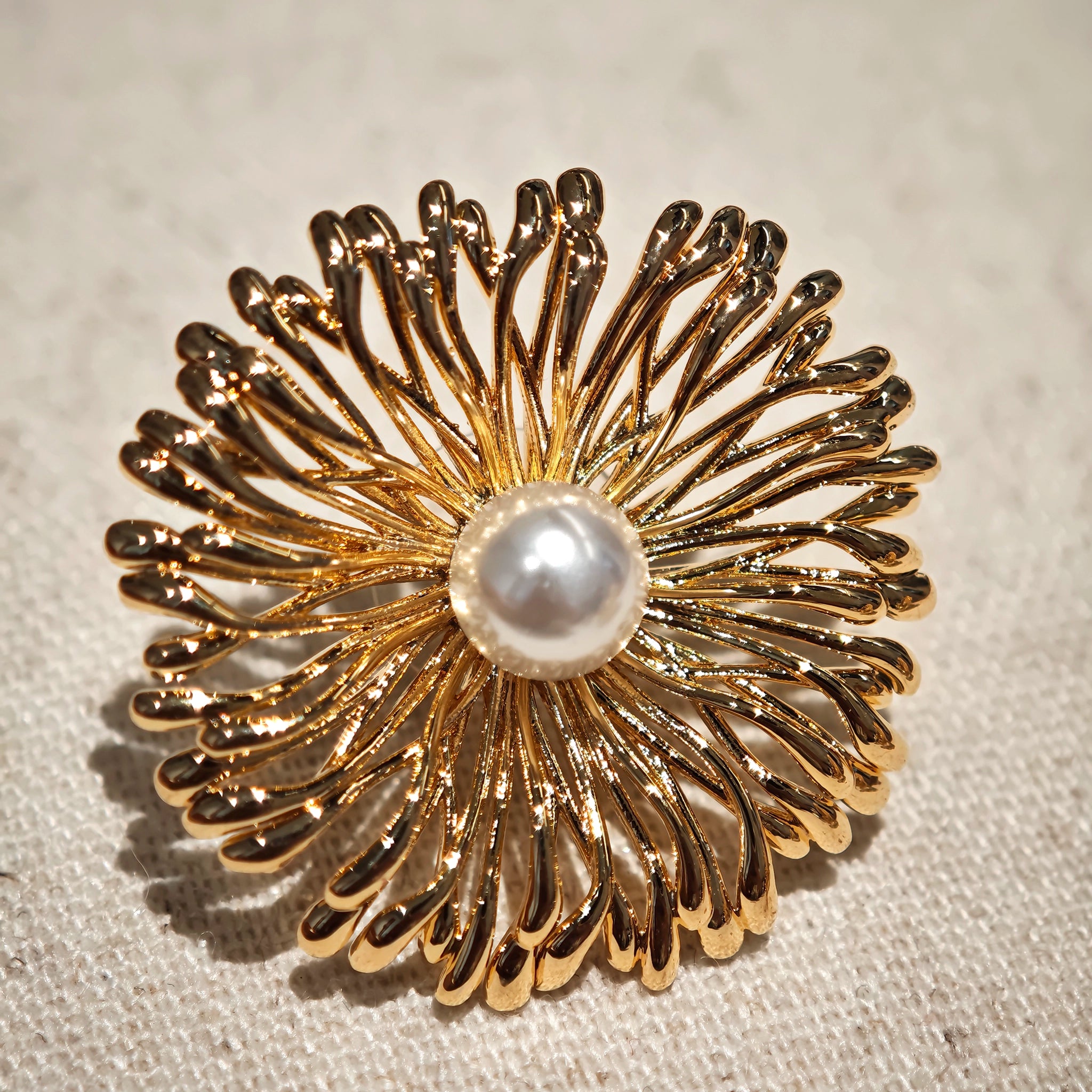 These earrings perfectly blend delicate flowers with lustrous pearls, exuding timeless romance and adding an elegant touch to any outfit.