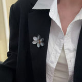 Features a stunning 7-7.5mm natural freshwater baroque pearl as the centerpiece, surrounded by artistically sculpted shell petals and vibrant red agate/black onyx accents. This flower brooch blends vintage charm with modern "light luxury" style, making it a captivating focal point for any outfit.