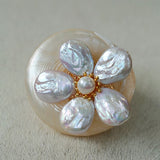 Features a stunning 7-7.5mm natural freshwater baroque pearl as the centerpiece, surrounded by artistically sculpted shell petals and vibrant red agate/black onyx accents. This flower brooch blends vintage charm with modern "light luxury" style, making it a captivating focal point for any outfit.