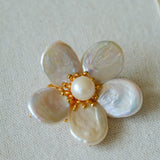 Features a stunning 7-7.5mm natural freshwater baroque pearl as the centerpiece, surrounded by artistically sculpted shell petals and vibrant red agate/black onyx accents. This flower brooch blends vintage charm with modern "light luxury" style, making it a captivating focal point for any outfit.