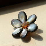 Features a stunning 7-7.5mm natural freshwater baroque pearl as the centerpiece, surrounded by artistically sculpted shell petals and vibrant red agate/black onyx accents. This flower brooch blends vintage charm with modern "light luxury" style, making it a captivating focal point for any outfit.