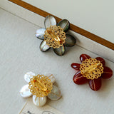 Features a stunning 7-7.5mm natural freshwater baroque pearl as the centerpiece, surrounded by artistically sculpted shell petals and vibrant red agate/black onyx accents. This flower brooch blends vintage charm with modern "light luxury" style, making it a captivating focal point for any outfit.