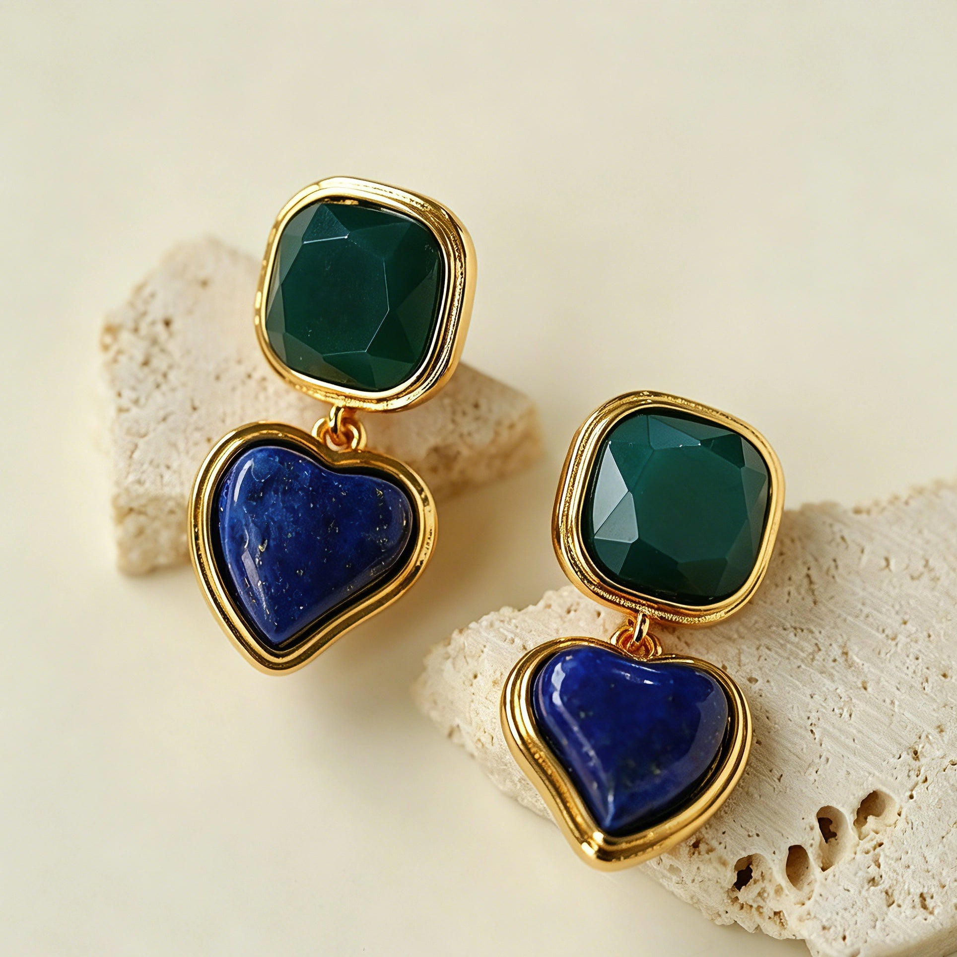 These French vintage-style drop earrings feature a geometric design, crafted with polished gold-tone metal settings. Each earring is adorned with two linked gemstone pendants: a cushion-cut square top and a heart-shaped bottom, made from natural agate in rich, varied hues like warm orange, deep blue, forest green, and vibrant red. The elegant, retro silhouette blends classic charm with a bold, colorful aesthetic, perfect for adding a statement touch to any look.