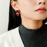 These French vintage-style drop earrings feature a geometric design, crafted with polished gold-tone metal settings. Each earring is adorned with two linked gemstone pendants: a cushion-cut square top and a heart-shaped bottom, made from natural agate in rich, varied hues like warm orange, deep blue, forest green, and vibrant red. The elegant, retro silhouette blends classic charm with a bold, colorful aesthetic, perfect for adding a statement touch to any look.