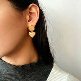 These French vintage-style drop earrings feature a geometric design, crafted with polished gold-tone metal settings. Each earring is adorned with two linked gemstone pendants: a cushion-cut square top and a heart-shaped bottom, made from natural agate in rich, varied hues like warm orange, deep blue, forest green, and vibrant red. The elegant, retro silhouette blends classic charm with a bold, colorful aesthetic, perfect for adding a statement touch to any look.
