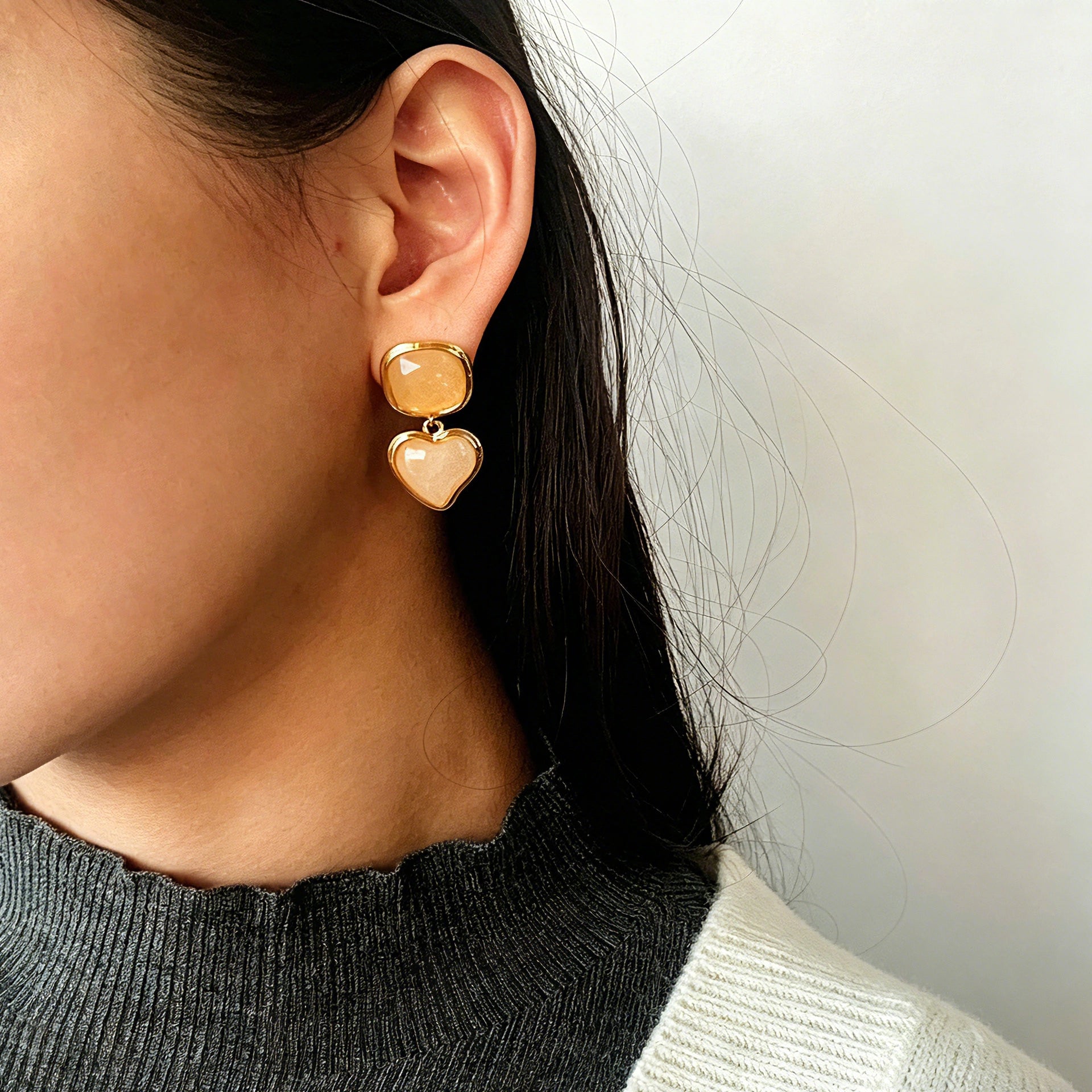 These French vintage-style drop earrings feature a geometric design, crafted with polished gold-tone metal settings. Each earring is adorned with two linked gemstone pendants: a cushion-cut square top and a heart-shaped bottom, made from natural agate in rich, varied hues like warm orange, deep blue, forest green, and vibrant red. The elegant, retro silhouette blends classic charm with a bold, colorful aesthetic, perfect for adding a statement touch to any look.