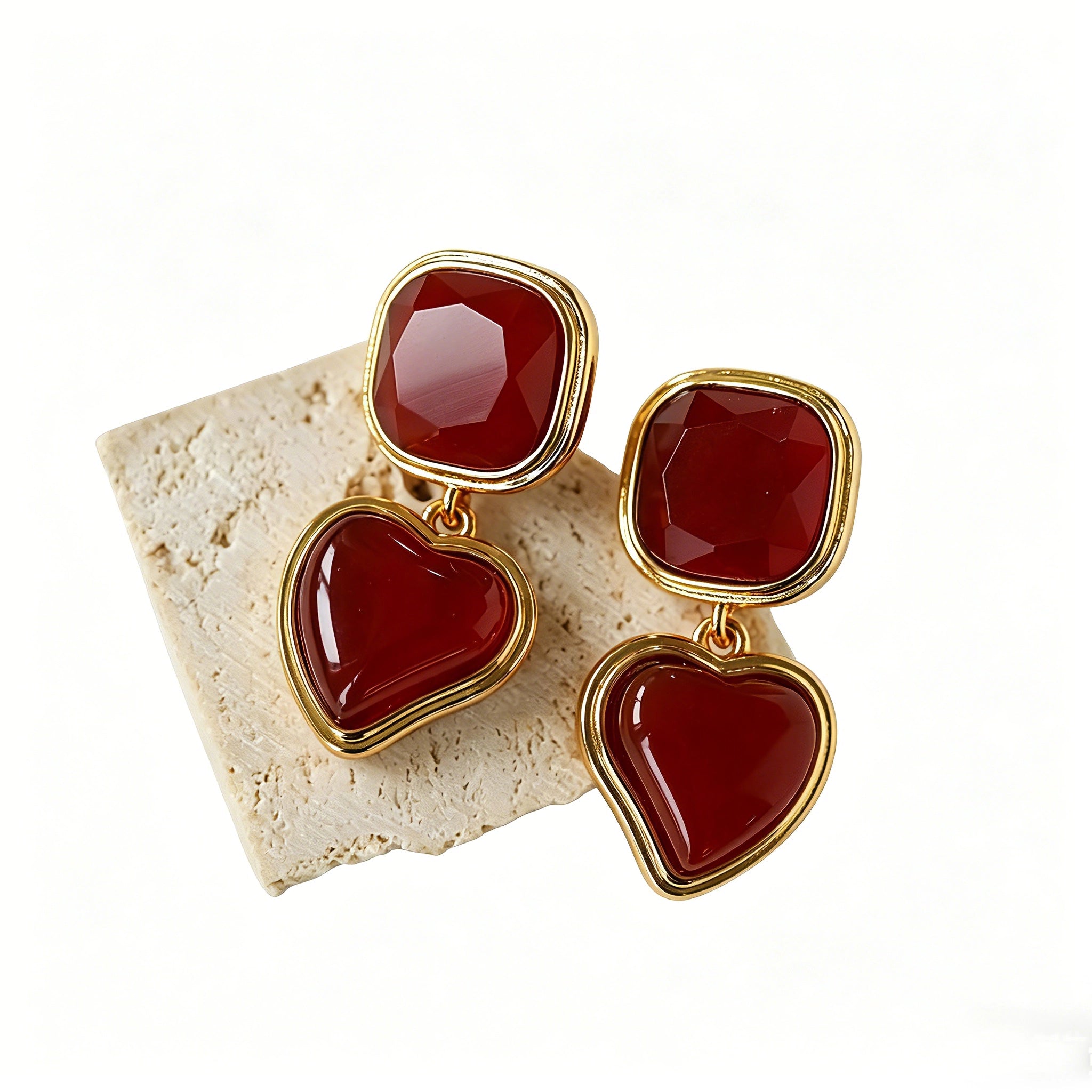 These French vintage-style drop earrings feature a geometric design, crafted with polished gold-tone metal settings. Each earring is adorned with two linked gemstone pendants: a cushion-cut square top and a heart-shaped bottom, made from natural agate in rich, varied hues like warm orange, deep blue, forest green, and vibrant red. The elegant, retro silhouette blends classic charm with a bold, colorful aesthetic, perfect for adding a statement touch to any look.