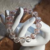 This is a golden strawberry quartz and Clear Quartz bracelet, with unique transparency and elegance.