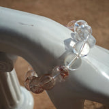 This is a golden strawberry quartz and Clear Quartz bracelet, with unique transparency and elegance.