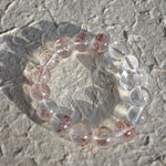 This is a golden strawberry quartz and Clear Quartz bracelet, with unique transparency and elegance.