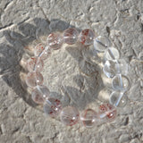 This is a golden strawberry quartz and Clear Quartz bracelet, with unique transparency and elegance.