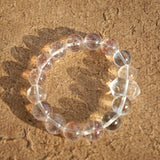 This is a golden strawberry quartz and Clear Quartz bracelet, with unique transparency and elegance.