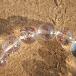 This is a golden strawberry quartz and Clear Quartz bracelet, with unique transparency and elegance.