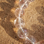 This is a golden strawberry quartz and Clear Quartz bracelet, with unique transparency and elegance.