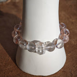 This is a golden strawberry quartz and Clear Quartz bracelet, with unique transparency and elegance.