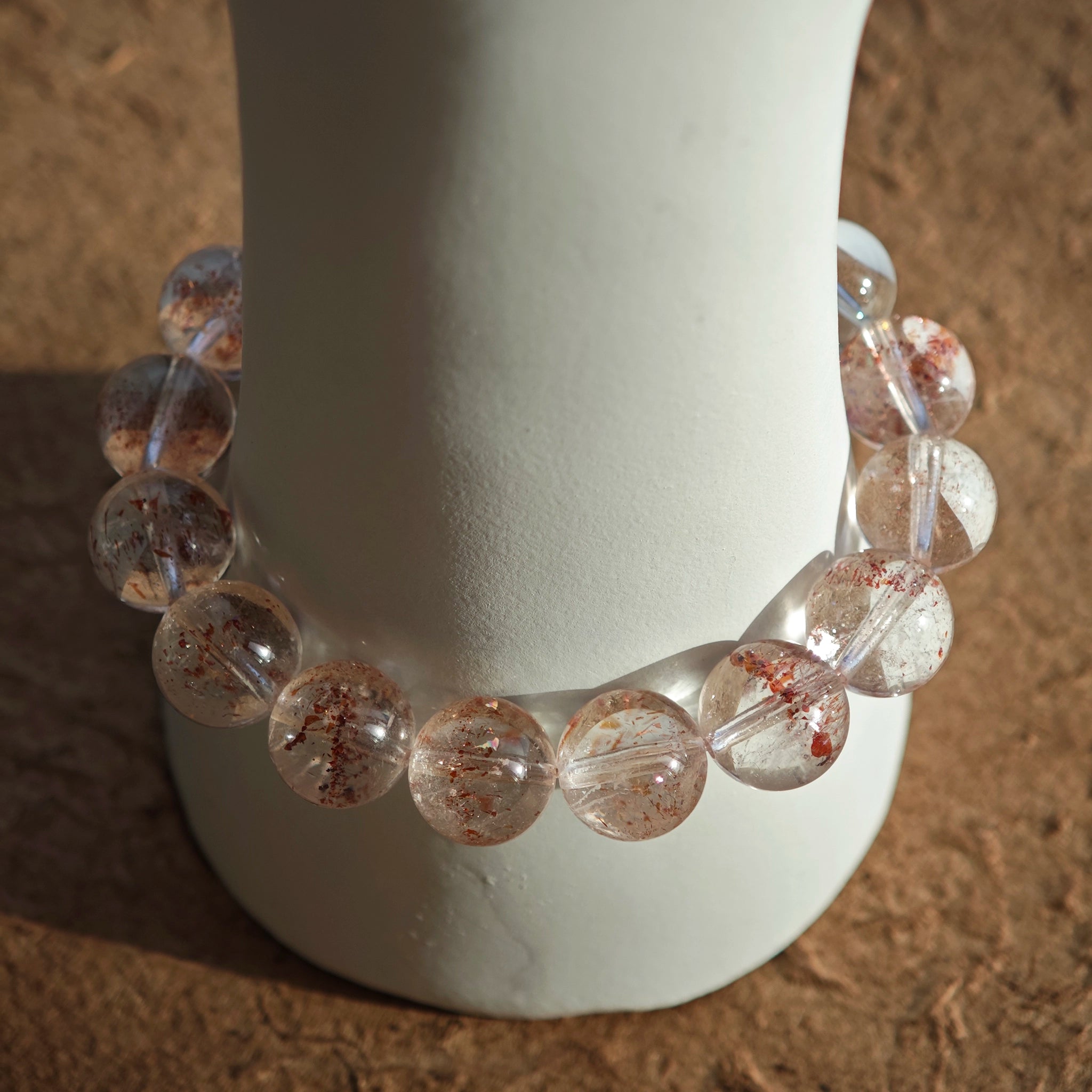 This is a golden strawberry quartz and Clear Quartz bracelet, with unique transparency and elegance.