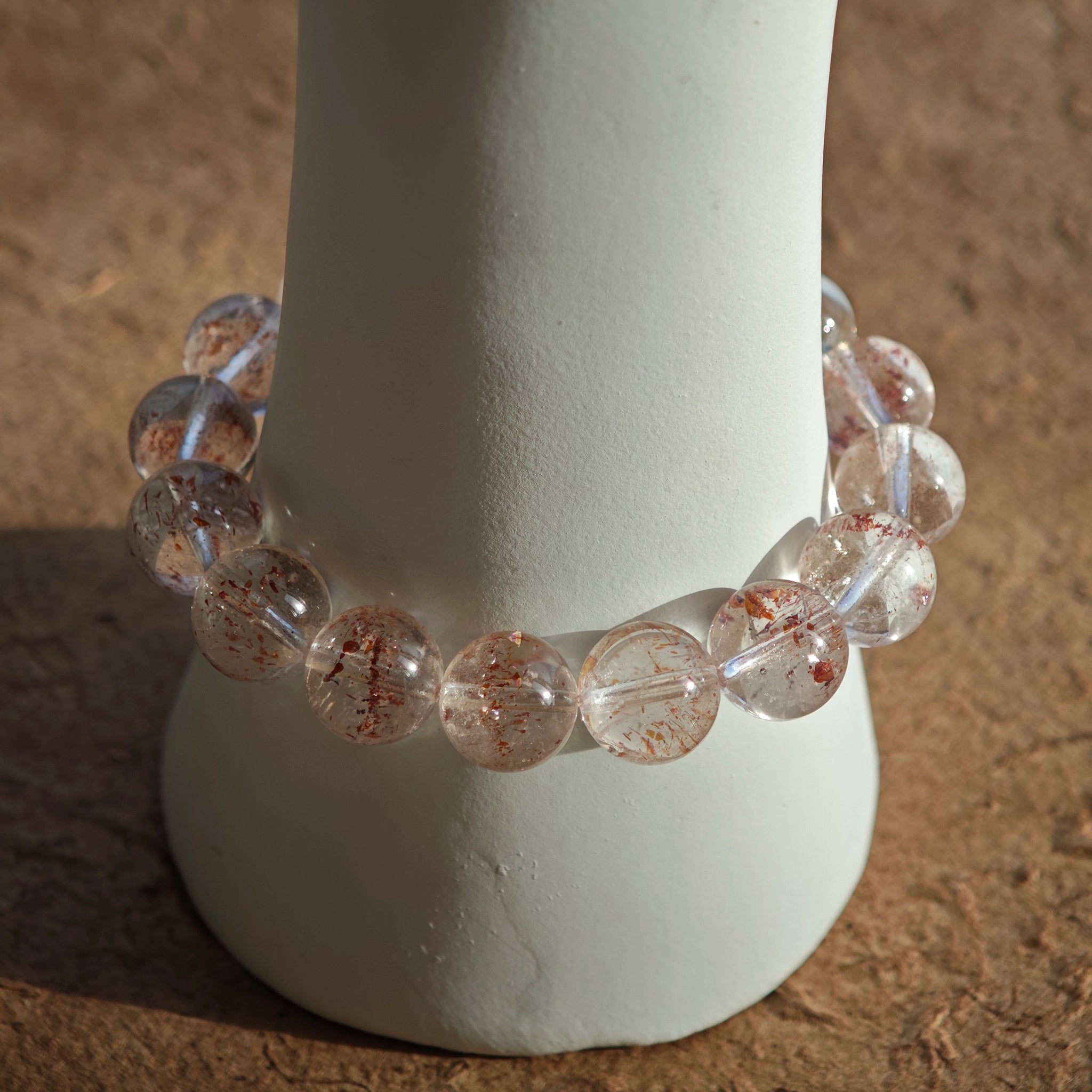This is a golden strawberry quartz and Clear Quartz bracelet, with unique transparency and elegance.