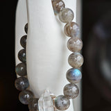 This grey moonstone bracelet consists of 17 grey moonstone and 1 clear quartz. It's mystery and elegant.