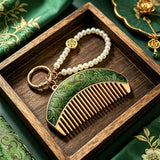 These mini comb keychains are crafted with elegant Chinese Song brocade fabric, showcasing classic traditional patterns in soft green, blush pink, and vintage cream tones. Each delicate hair comb pendant is matched with a glossy pearl lanyard and golden hardware, blending ancient oriental aesthetics with portable daily accessory design. A charming small heritage-style ornament perfect for bags, keys and gifting.