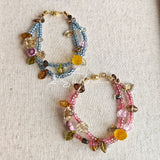 This bracelet features shimmering Czech glass beads in beautiful shades of blue, all hand-strung on a delicate double chain. An 18k gold-plated magnetic clasp makes it super easy to wear, and it's designed for a 15cm wrist.