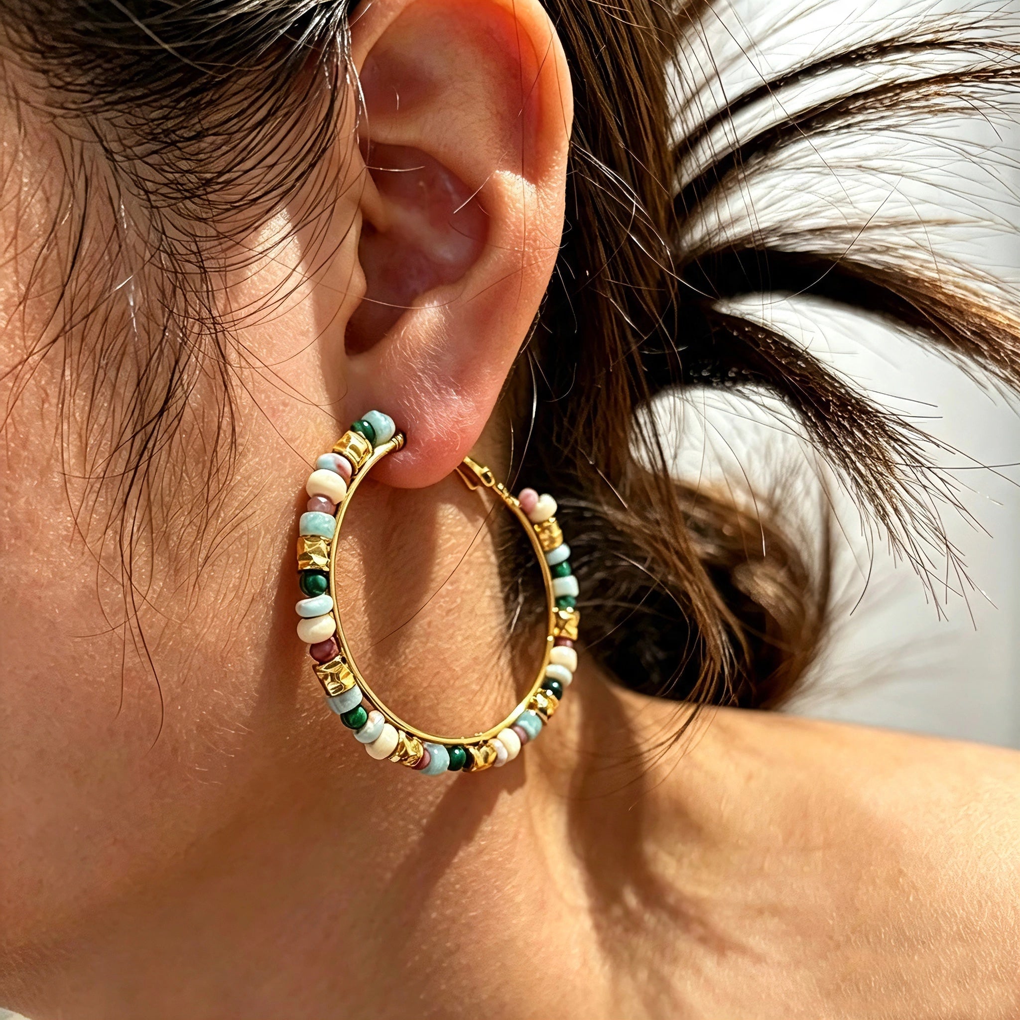 These women’s hoop earrings are crafted from durable stainless‑steel hoops decorated with vibrant natural stone beads. The colorful mixed‑stone design brings a fresh bohemian vibe, adding lively visual charm to your outfits. They are lightweight and ideal for daily wear as well as casual‑party styling.
