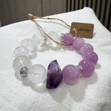 This is a multi gemstones bracelet consists of Kunzite, White Phantom Quartzs and Raw Amethysts. The beads are between 14.5 and 15.5mm. And in the bracelets, there are  hypoallergenic silver spacers and floral accents.