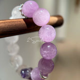 This is a multi gemstones bracelet consists of Kunzite, White Phantom Quartzs and Raw Amethysts. The beads are between 14.5 and 15.5mm. And in the bracelets, there are  hypoallergenic silver spacers and floral accents.