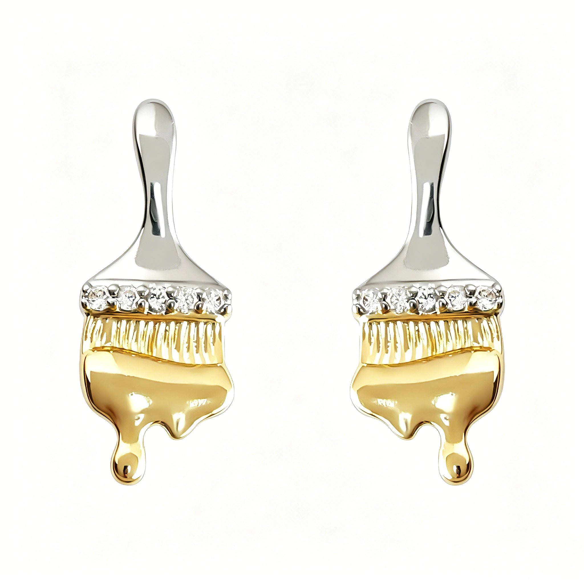 These stud earrings are designed in the shape of a paintbrush, featuring a two-tone finish with a polished silver-toned handle and a gold-toned brush head. The ferrule of the brush is encrusted with sparkling cubic zirconia stones, and the gold-toned bristles are styled to look like dripping, liquid gold paint, creating a vivid, artistic effect. Crafted with a thick 18K real gold plating, they combine a playful, creative design with elegant, eye-catching sparkle.