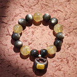 Twelve-millimeter lunar beads clash with thirteen-millimeter solar crystals, softened by agarwood incense and Nanhong’s imperial hue.