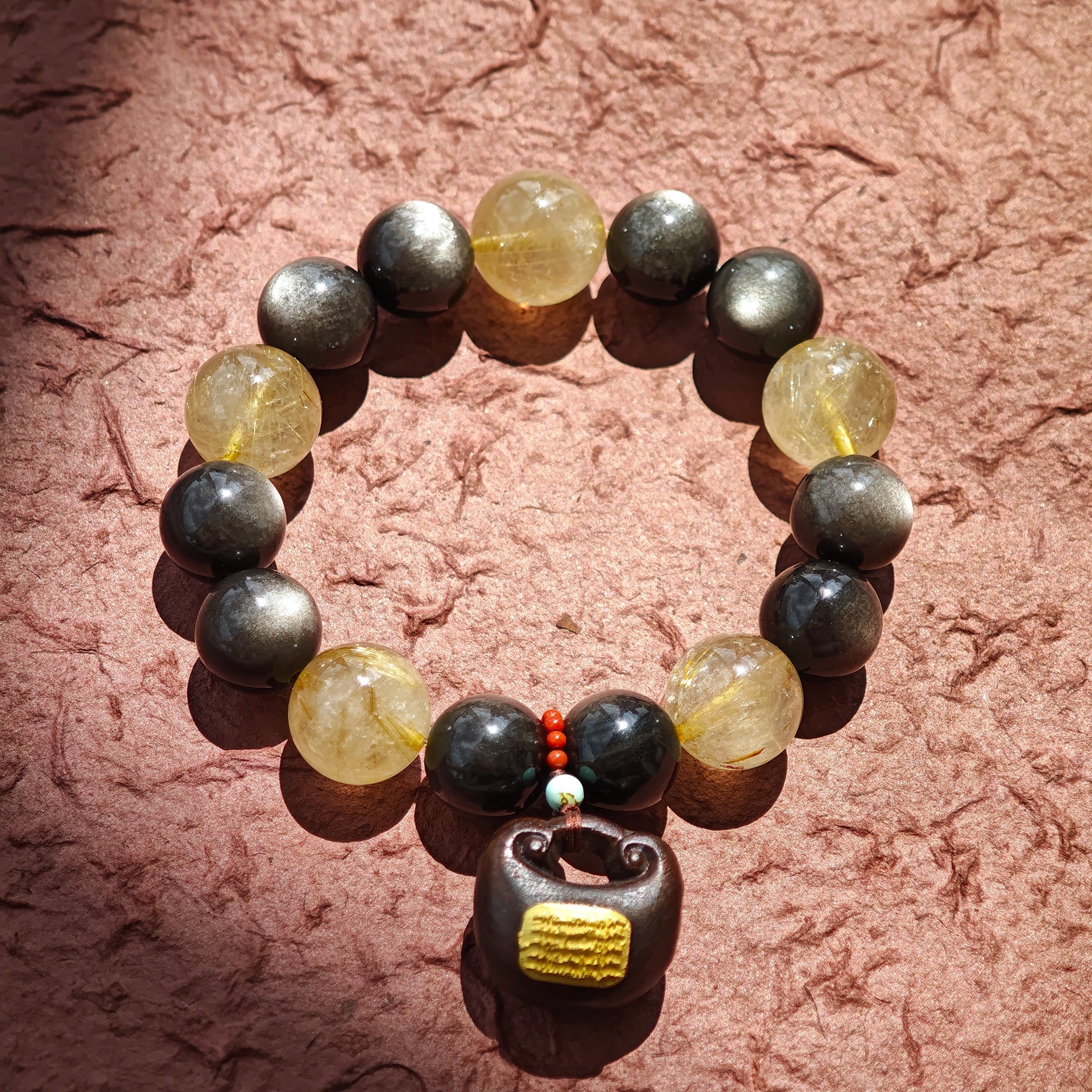 Twelve-millimeter lunar beads clash with thirteen-millimeter solar crystals, softened by agarwood incense and Nanhong’s imperial hue.