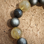 Silver obsidian mirrors night, golden rutile captures dawn, while agarwood and Nanhong seal ancient energy in opulent style.