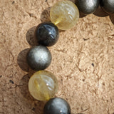 Silver obsidian mirrors night, golden rutile captures dawn, while agarwood and Nanhong seal ancient energy in opulent style.