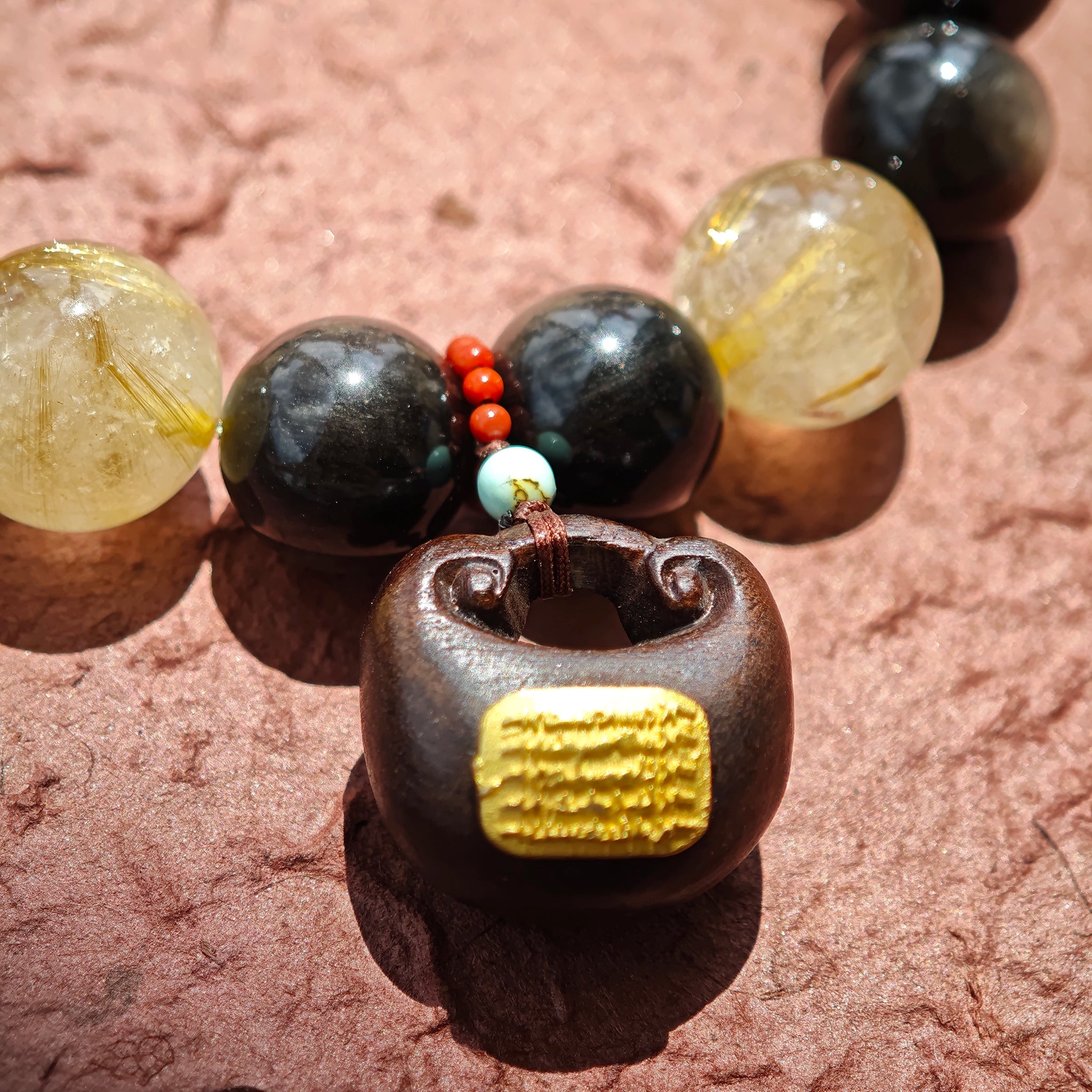 Volcanic gloss meets solar sparkle; sacred wood meets imperial stone—a bracelet that roars quiet wealth.