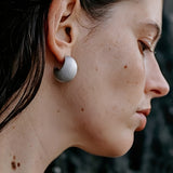 These minimalist high-end stud earrings feature a plump crescent C-shaped design with delicate frosted texture on the whole surface. They are available in two classic colors: elegant gold and versatile silver. With smooth curved lines, the earrings bring understated luxury and fashionable daily wear sense.
