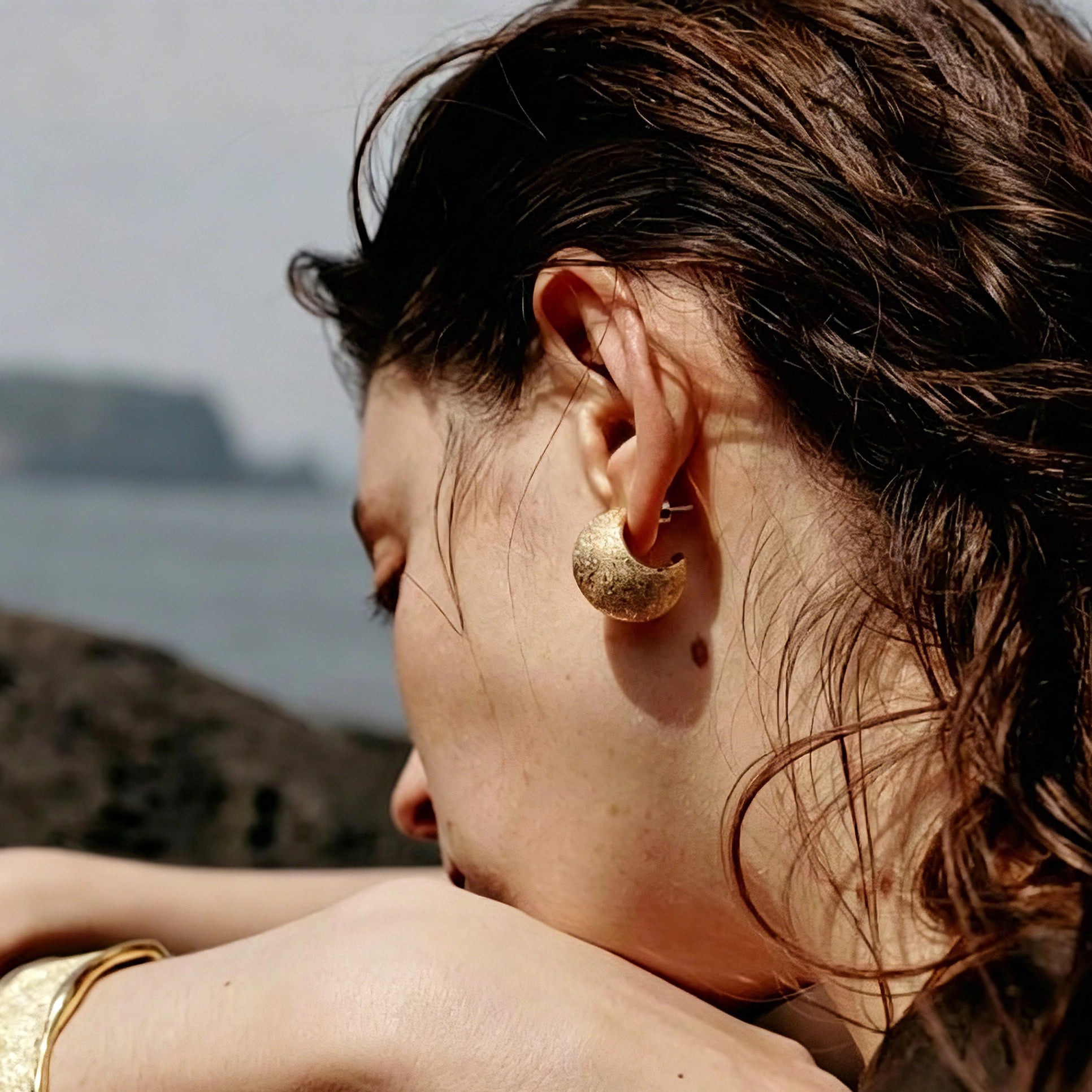These minimalist high-end stud earrings feature a plump crescent C-shaped design with delicate frosted texture on the whole surface. They are available in two classic colors: elegant gold and versatile silver. With smooth curved lines, the earrings bring understated luxury and fashionable daily wear sense.