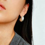 These minimalist high-end stud earrings feature a plump crescent C-shaped design with delicate frosted texture on the whole surface. They are available in two classic colors: elegant gold and versatile silver. With smooth curved lines, the earrings bring understated luxury and fashionable daily wear sense.