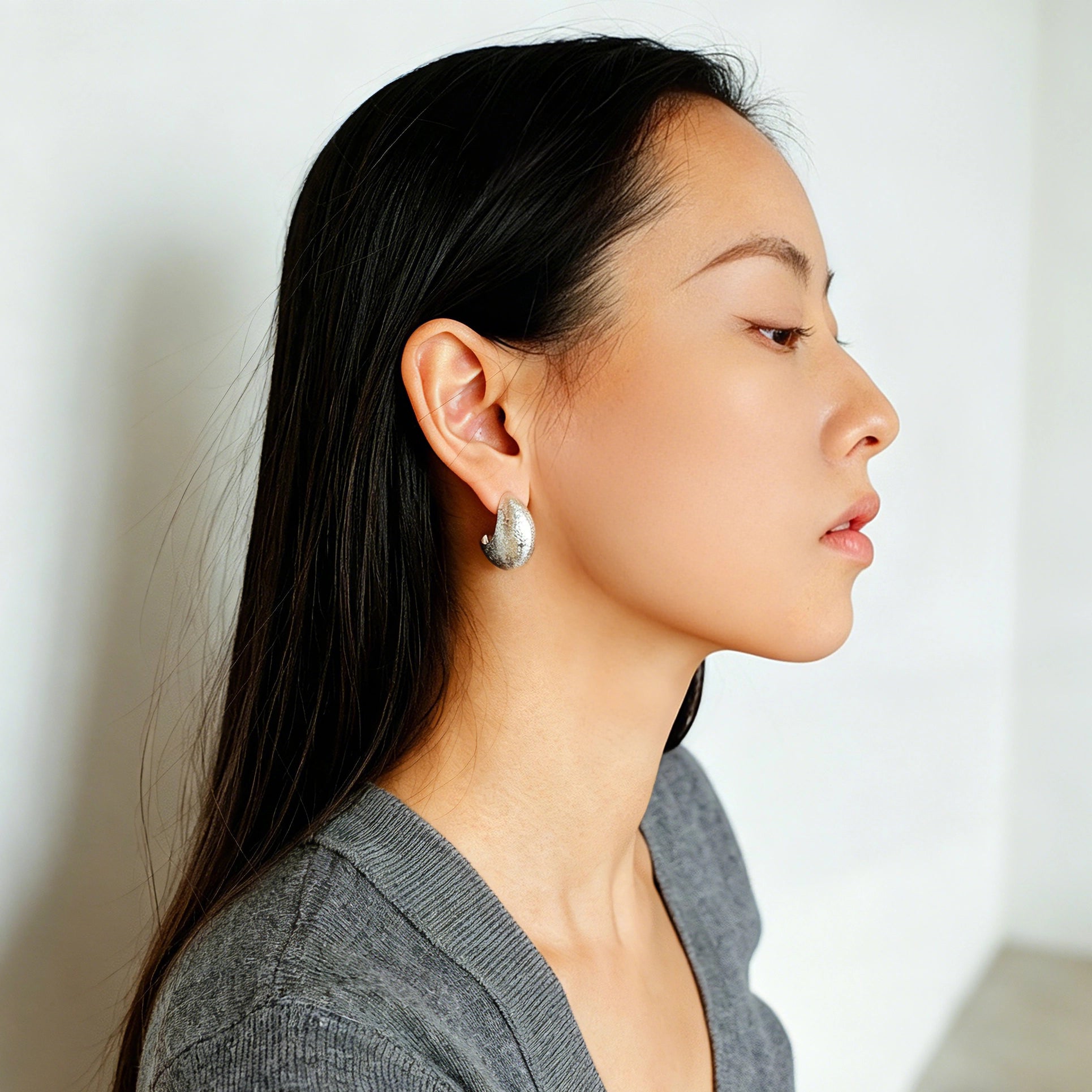 These minimalist high-end stud earrings feature a plump crescent C-shaped design with delicate frosted texture on the whole surface. They are available in two classic colors: elegant gold and versatile silver. With smooth curved lines, the earrings bring understated luxury and fashionable daily wear sense.