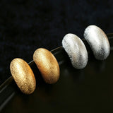 These minimalist high-end stud earrings feature a plump crescent C-shaped design with delicate frosted texture on the whole surface. They are available in two classic colors: elegant gold and versatile silver. With smooth curved lines, the earrings bring understated luxury and fashionable daily wear sense.