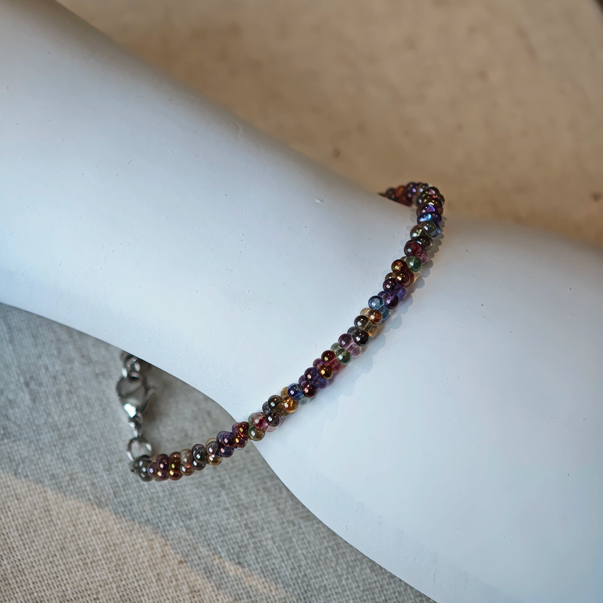 This is a minimalist necklace bracelet set with Peanut shape glass beads.