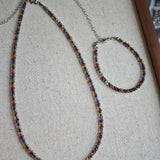 This is a minimalist necklace bracelet set with Peanut shape glass beads.