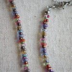 This is a minimalist necklace bracelet set with Peanut shape glass beads.
