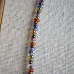 This is a minimalist necklace bracelet set with Peanut shape glass beads.