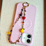 This handmade Czech glass bead bag charm is also perfect as a phone strap, keychain accessory, or a car decor. Featuring translucent beads, fruity spacers (pear, lemon, strawberry!), whimsical floral leaves and durable gold-tone hardware, it’s like wearing a garden on your keys.