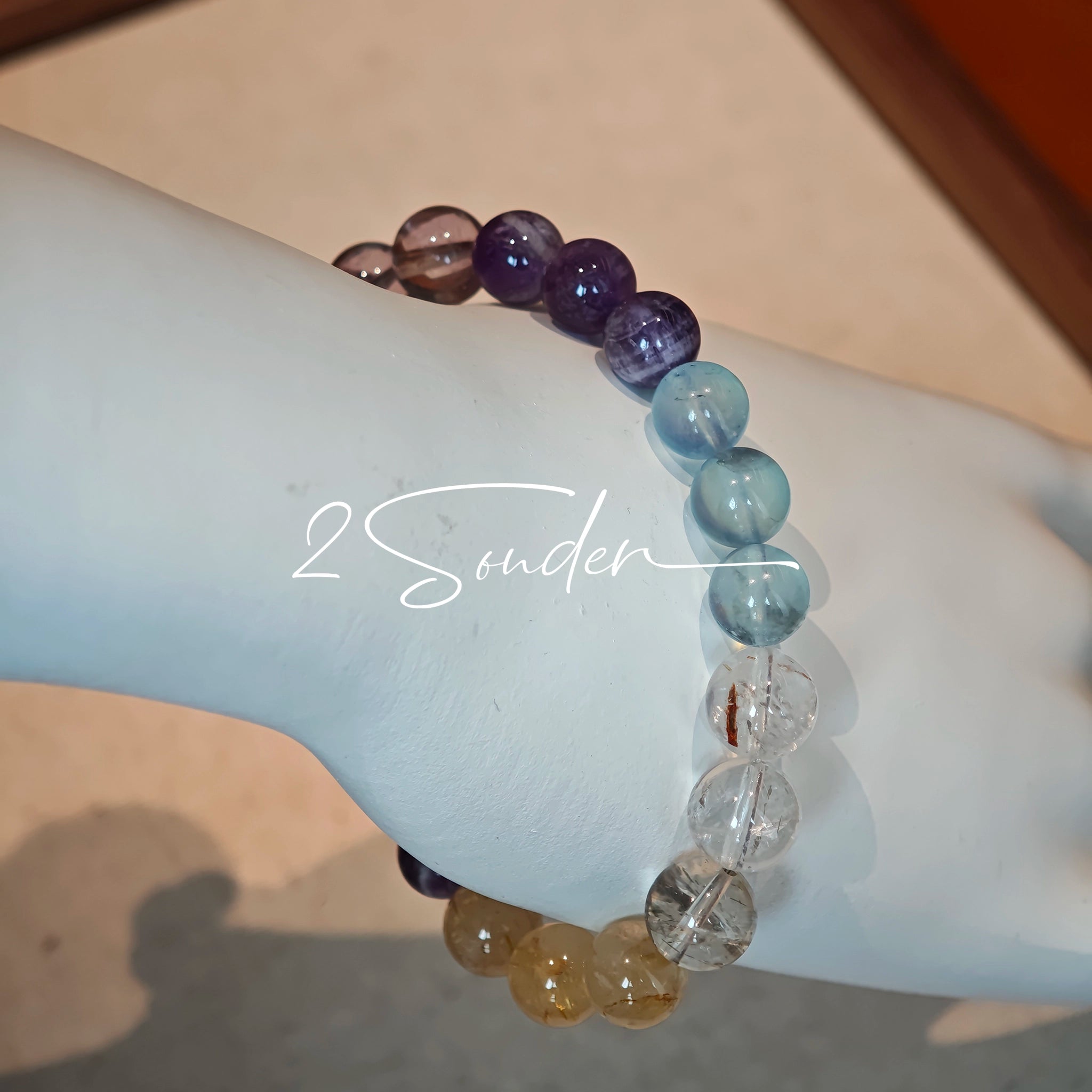 This is a gemstone bracelet consists of different gemstones. They are blue aquamarines, purple amethysts, yellow citrines and transparent clear quartz. It's with 16cm circumference.