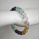 This is a gemstone bracelet consists of different gemstones. They are blue aquamarines, purple amethysts, yellow citrines and transparent clear quartz. It's with 16cm circumference.