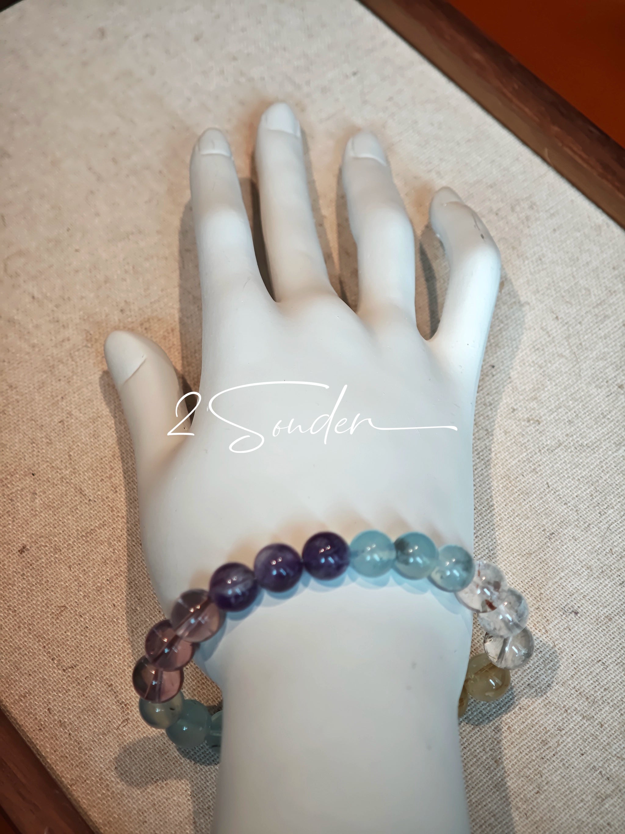 This is a gemstone bracelet consists of different gemstones. They are blue aquamarines, purple amethysts, yellow citrines and transparent clear quartz. It's with 16cm circumference.