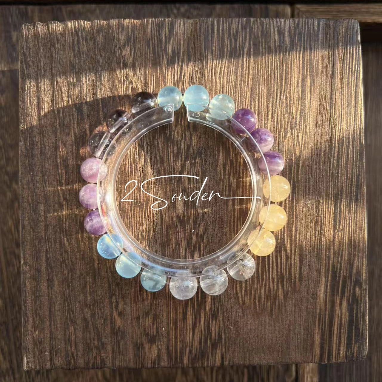 This is a gemstone bracelet consists of different gemstones. They are blue aquamarines, purple amethysts, yellow citrines and transparent clear quartz. It's with 16cm circumference.