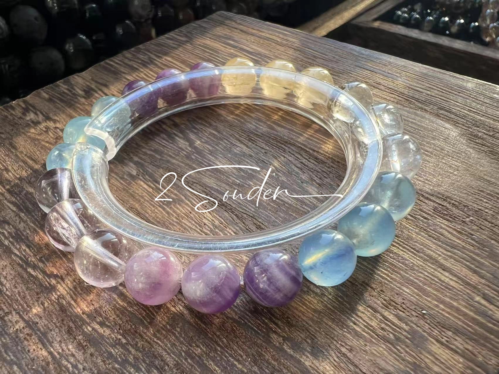 This is a gemstone bracelet consists of different gemstones. They are blue aquamarines, purple amethysts, yellow citrines and transparent clear quartz. It's with 16cm circumference.