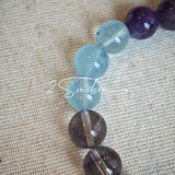 This is a gemstone bracelet consists of different gemstones. They are blue aquamarines, purple amethysts, yellow citrines and transparent clear quartz. It's with 16cm circumference.